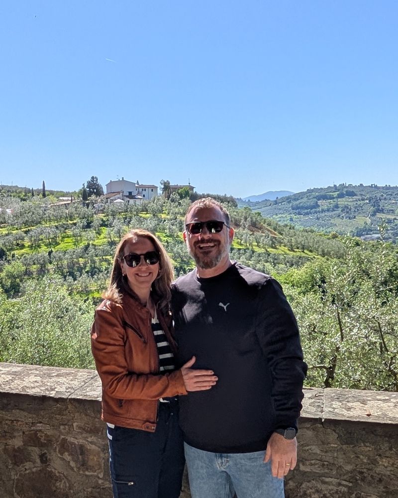 Mark Succarotte and family overlooking the olive groves of Tuscany